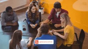 Profissionais participam de reunião em ambiente corporativo, representando ações de acompanhamento, gestão de pessoas e monitoramento de riscos psicossociais no ambiente de trabalho.